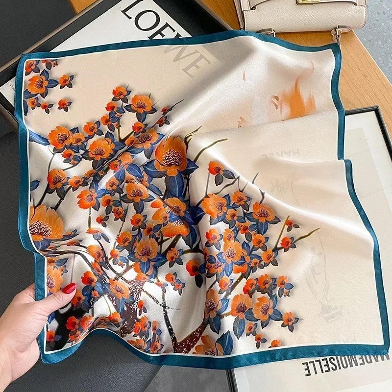 Lenco Versatile Grace branco com flores laranjas e ramos azulados, com moldura azul petróleo