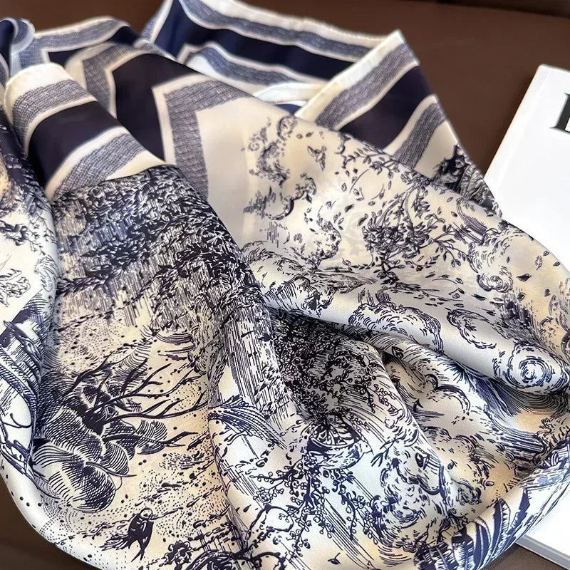 Lenco Versatile Grace completamente aberto com estampa azul toile de jouy exibindo sua leveza e brilho