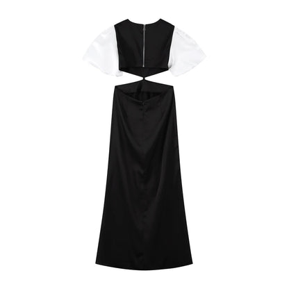 Vestido Margot visto por tras, destacando a amarracao ajustavel e mangas bufantes brancas sobre fundo branco