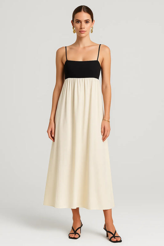 Modelo usando o Vestido Milano em estúdio, com alças finas e silhueta ampla, em fundo claro minimalista.