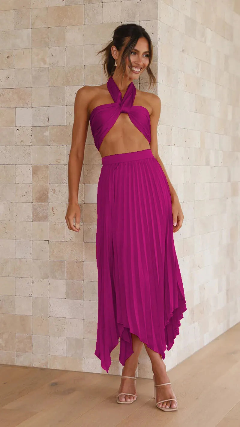 Conjunto plissado Selênia rosa magenta com saia midi plissada e top torcido