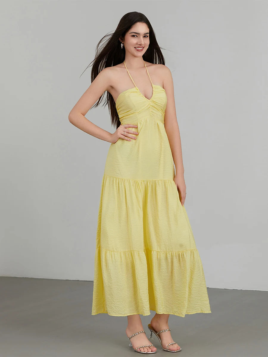 Vestido Diane amarelo em chiffon, modelo longo com decote em V halter e caimento elegante