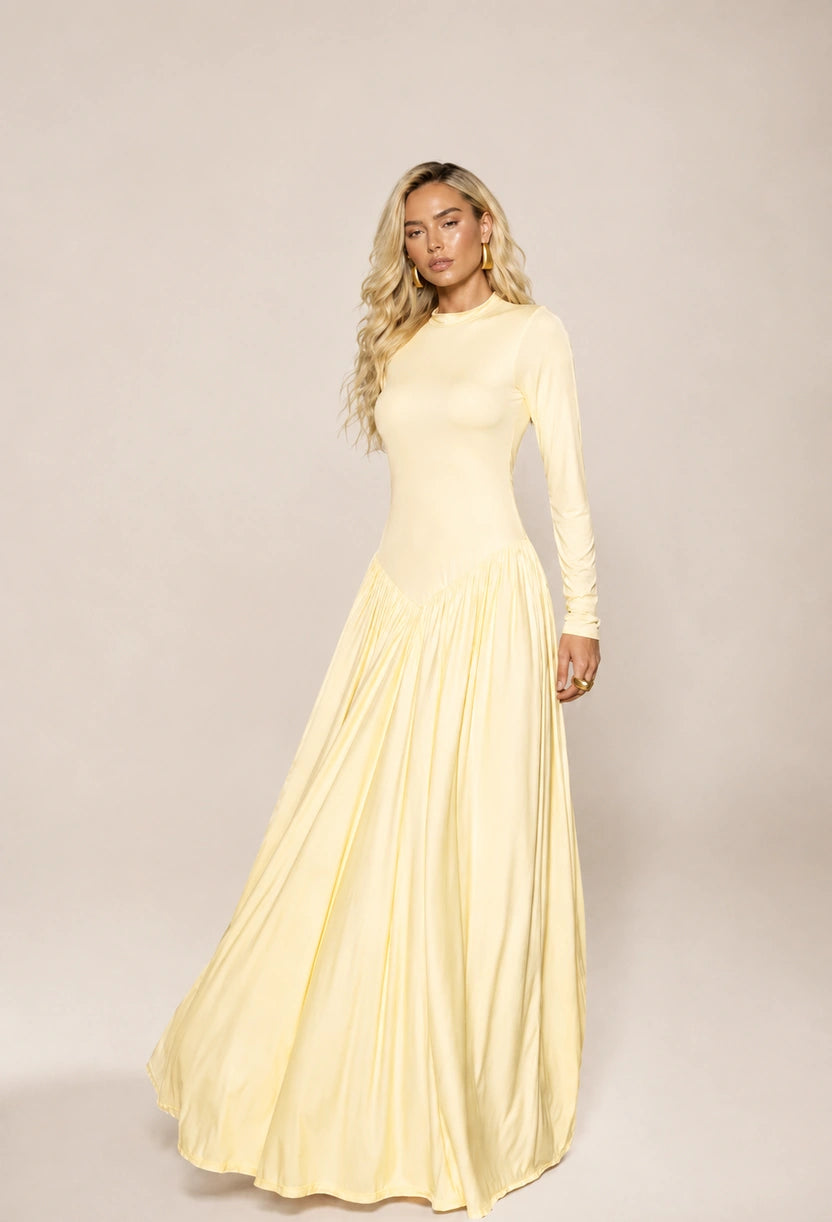 Vestido longo Antonella de gola alta e saia rodada, de frente com a saia em leve movimento