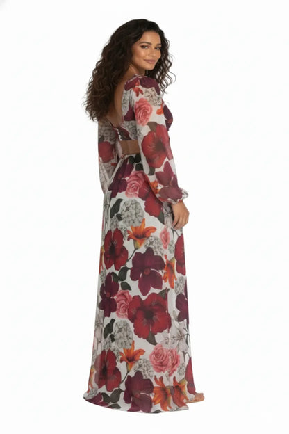 Vista traseira do Vestido Longo Tule Premium Jasmine Dress11 floral, com modelo olhando por cima do ombro, realçando a abertura nas costas e a fluidez do tecido.